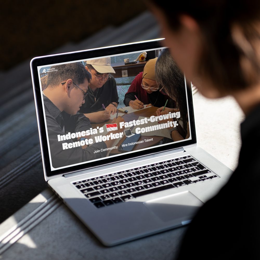 The Indonesia Remote Club website on a laptop, headlined “Indonesia’s Fastest-Growing Remote Worker Community”